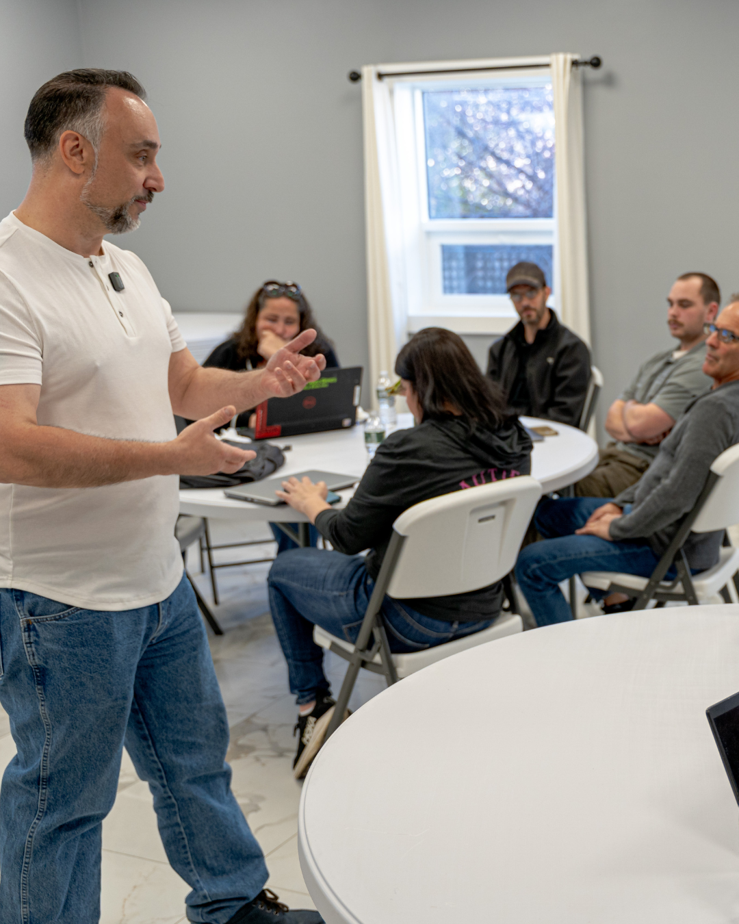 Glenn showing staff how to use the AI agent on deployment day